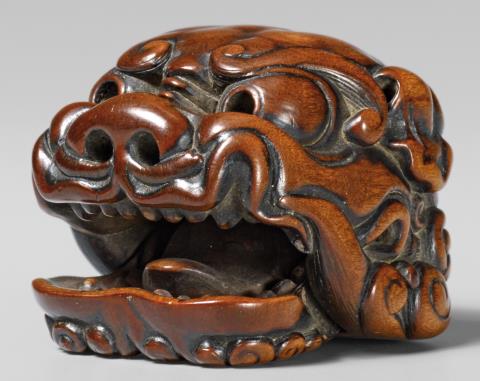 Antonio Martinez - A boxwood netsuke of a shishimai mask. Late 18th century