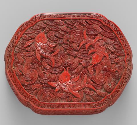 A carved red lacquer box. 19th century