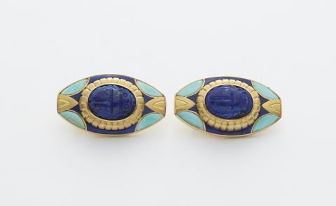 A pair of Egyptian style 18k gold clip earrings