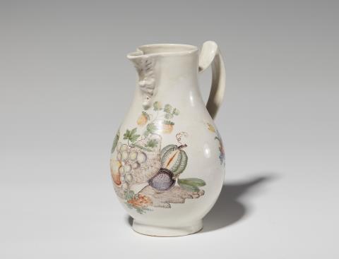  Durlach - A faience pitcher with a basket of fruit