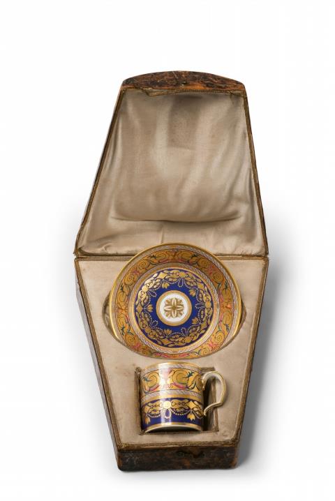 A Vienna porcelain cup with arabesque decor in the original case