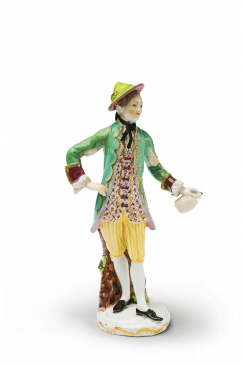  Vienna, Imperial Manufactory - A Vienna porcelain figure of a gentleman as a butler with a wine bottle