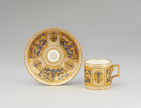A Vienna porcelain cup and saucer with blue arabesques