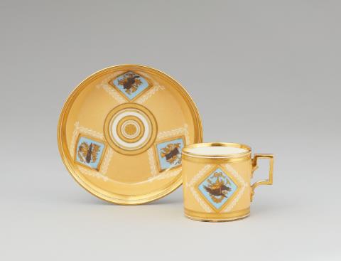 Vienna, Imperial Manufactory directed by Matthias Niedermayer - A Vienna porcelain cup and saucer with trophy decor