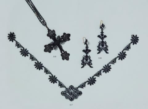 Johann Conrad Geiss - A cast iron cross pendant