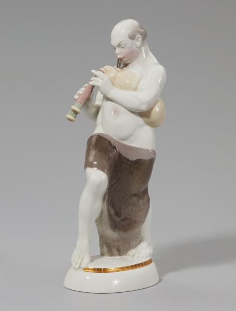 Adolph Amberg - A Berlin KPM porcelain figure of an Arabian man playing bagpipes