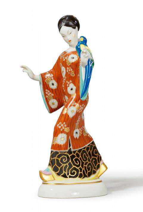 Adolph Amberg - A Berlin KPM porcelain model of a Chinese lady with a parrot