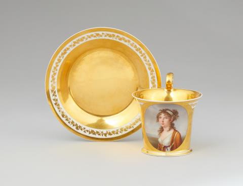  Vienna, Imperial Manufactory - A Vienna porcelain cup and saucer with a portrait of a young lady