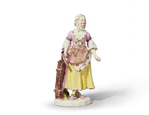  Vienna, Imperial Manufactory - A Vienna porcelain figure of a girl carrying wood