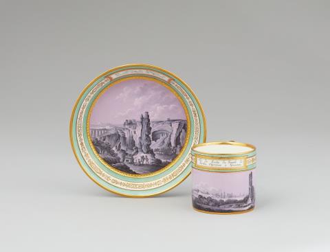 A Vienna porcelain cup and saucer with views of Syracuse