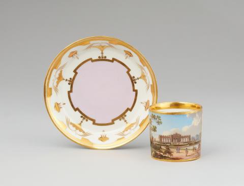 A Vienna porcelain cup and saucer "Vue de la Gloriétte au jardin de Schoenbrunn"