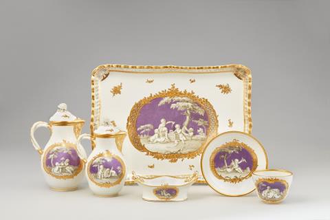  Vienna, Imperial Manufactory - A Vienna porcelain dejeuner with children en grisaille on lilac ground
