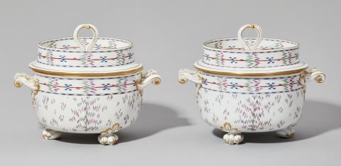 A pair of Nymphenburg porcelain ice pails with Atlas decor
