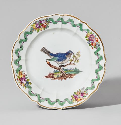 A Nymphenburg porcelain plate with birds and a green ribbon