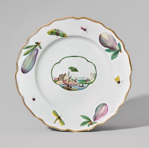 A Nymphenburg porcelain plate with a landscape and figs