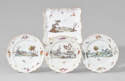 A Nymphenburg porcelain dish and three plates with green landscapes