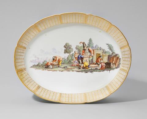An oval Nymphenburg porcelain plaque with a peasant scene
