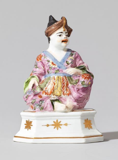 A rare Meissen porcelain figure of a seated male pagode