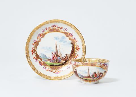 Christian Friedrich Herold - A Meissen porcelain cup and saucer with water landscapes