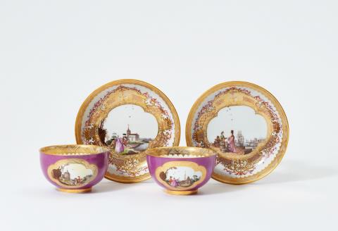 Christian Friedrich Herold - A pair of magnificently painted Meissen porcelain tea bowls and saucers with purple ground