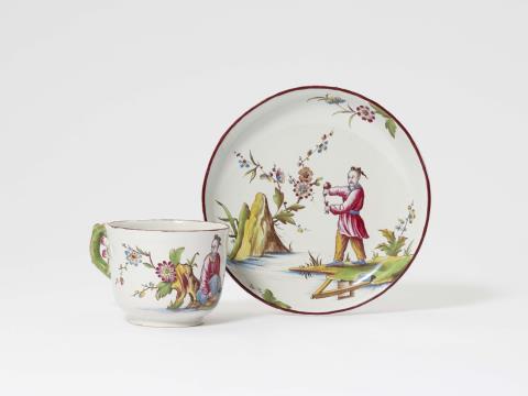A rare Höchst faience cup and saucer with Chinoiserie decor