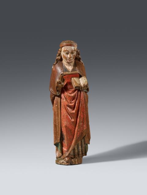 Flemish second half 15th century - A Flemish carved wooden figure of a Saint with a book, second half 15th century