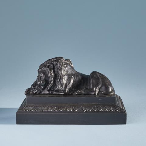 Theodor Kalide - A cast iron sleeping lion paperweight