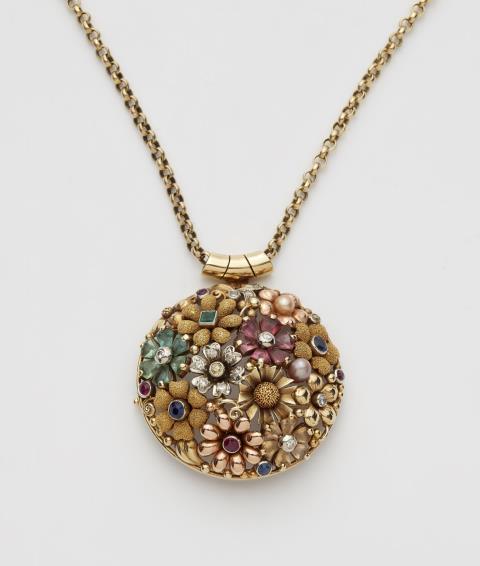 A 14k gold gemstone pendant brooch