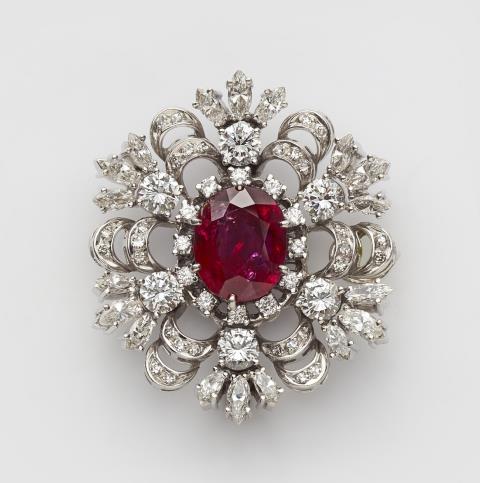 Paul Binder - A diamond and Burmese ruby adjustable brooch