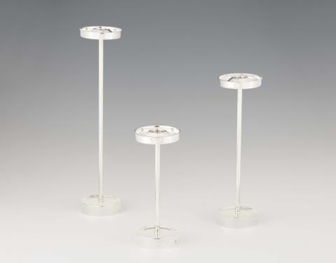 Three mid-century silver candlesticks