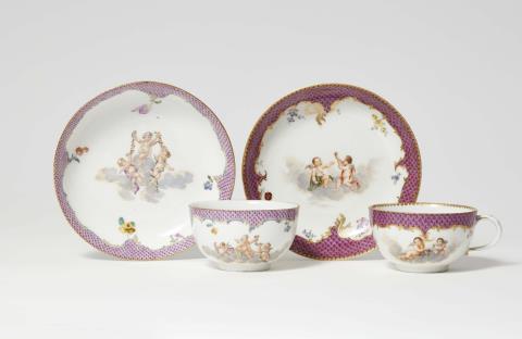 Andreas Oettner - Two Meissen porcelain cups and saucers with putto motifs
