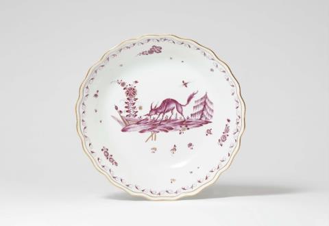 Adam Friedrich von Löwenfinck - A Meissen porcelain bowl with a purple fantastic beast motif