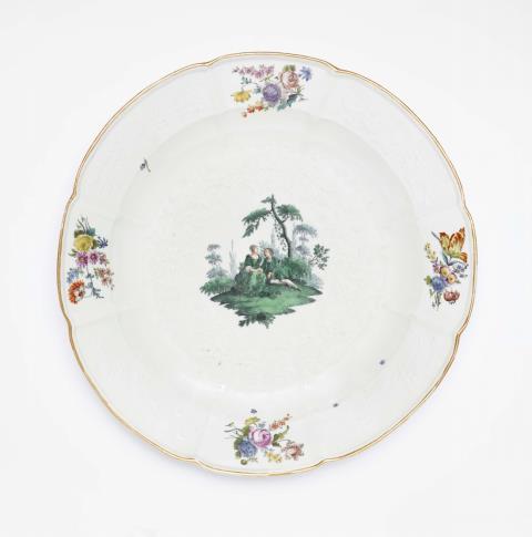 Johann Friedrich Eberlein - A Meissen porcelain dish with green Watteau motifs