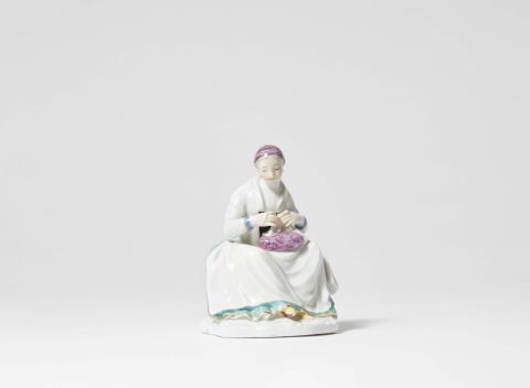Johann Friedrich Eberlein - A rare Meissen porcelain figure of a seamstress