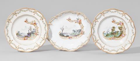 An oval Nymphenburg porcelain dish and two plates with green landscapes