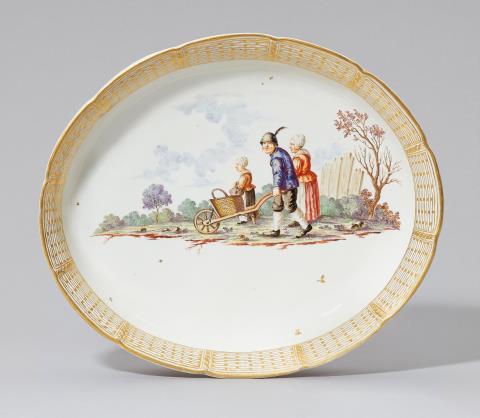 An oval Nymphenburg porcelain dish with a peasant scene