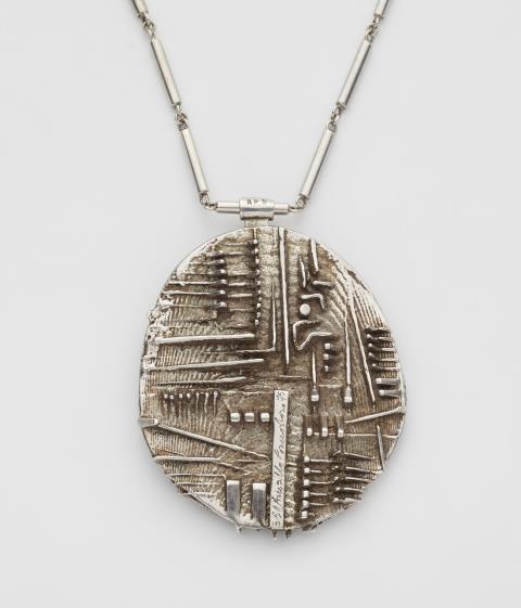 A structured Sterling silver pendant and chain