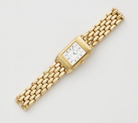 Jaeger Le Coultre - An 18k gold Reverso Lady Quartz wrist watch with box and papers