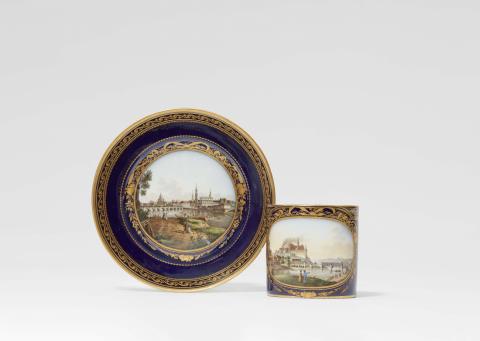 A Meissen porcelain cup with a view of Meissen and saucer with a view of Dresden