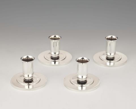 Four Georg Jensen Copenhagen silver candlesticks, model no. 748