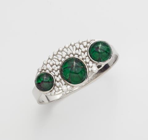 Hans-Leo Peters - An 18k white gold bangle with rare Trapiche emeralds.