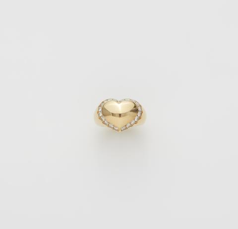 A French 18k gold and diamond heart ring.