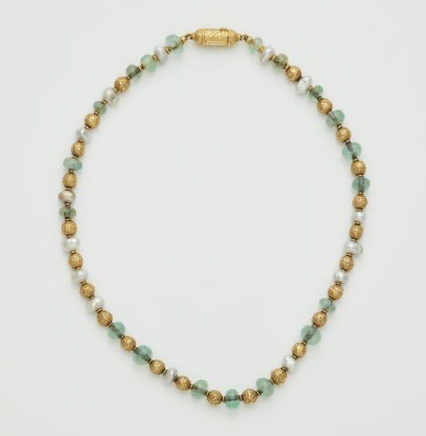 Wilhelm Nagel - A German 18 k gold beryl and pearl necklace.