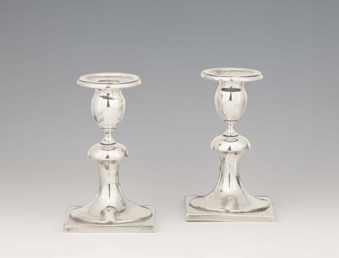 A pair of Krakau silver candlesticks