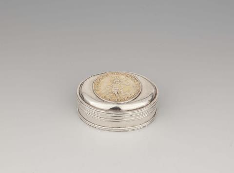 A Memel silver box with a communion medallion