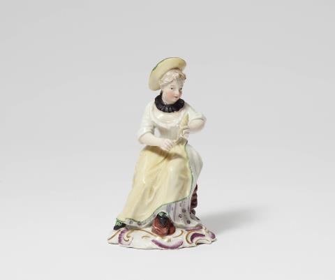 Johann Wilhelm Lanz - A Strasbourg porcelain figure of a lady spinning