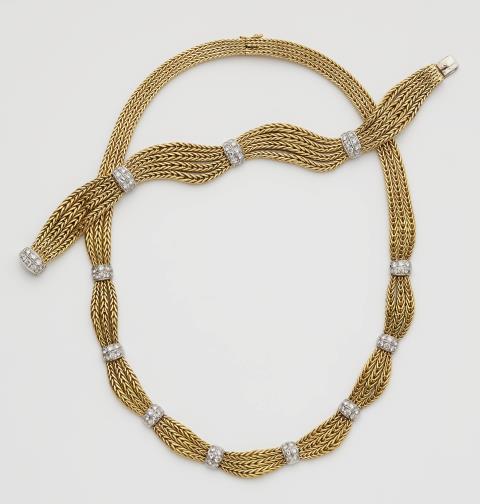 An 18k gold diamond garland necklace and bracelet.