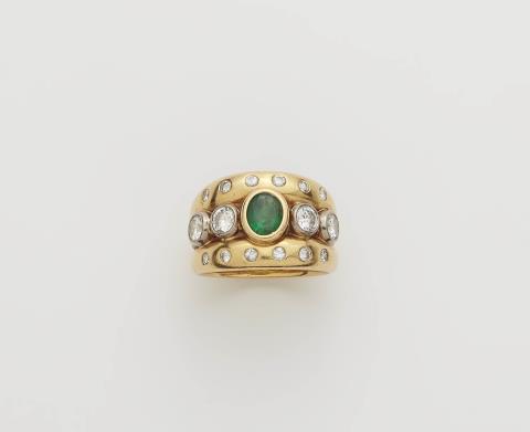 A German 18k gold diamond and emerald band ring.