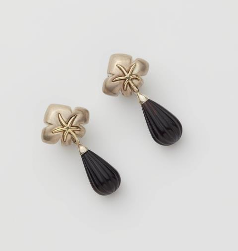Tiffany & Co. - A pair of sterling silver, 18k gold and onyx "Ivy Starfish" clip earrings.