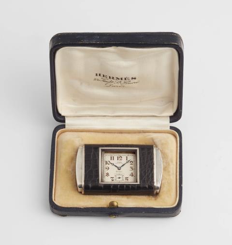  Hermès - A silver Hermès Otomato travel watch with Doxa movement.